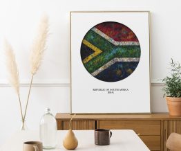 Framed South Africa Flag print on the wooden cabinet
