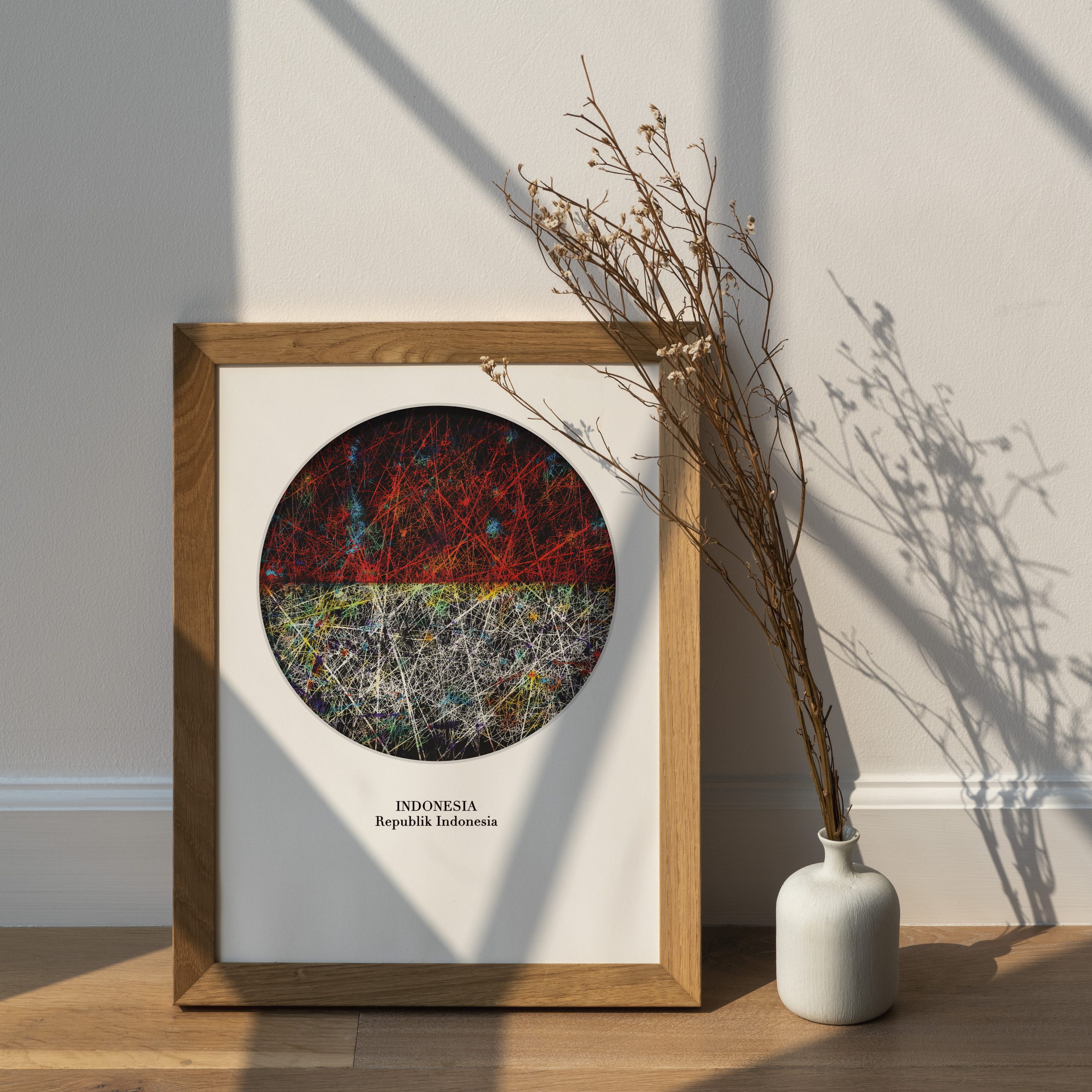 Dried white statice flower in a white vase by a wooden frame Dried white statice flower in a white vase by a wooden frame