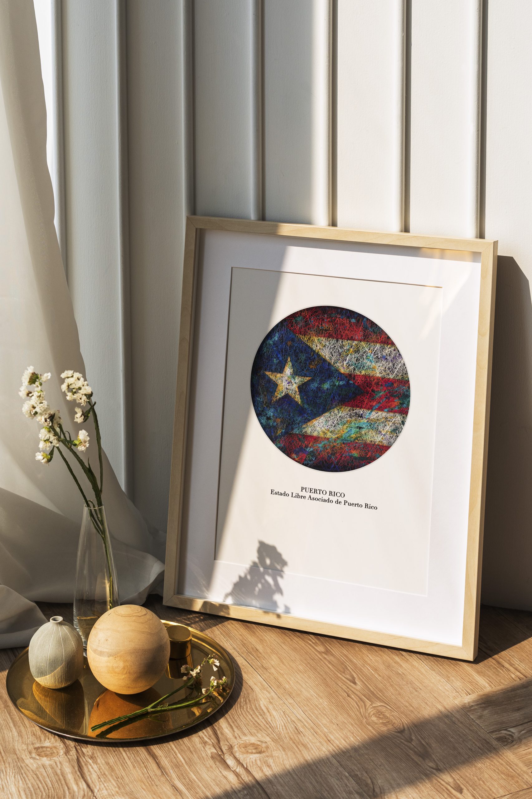 Picture frame mockup by a white wall on the wooden floor